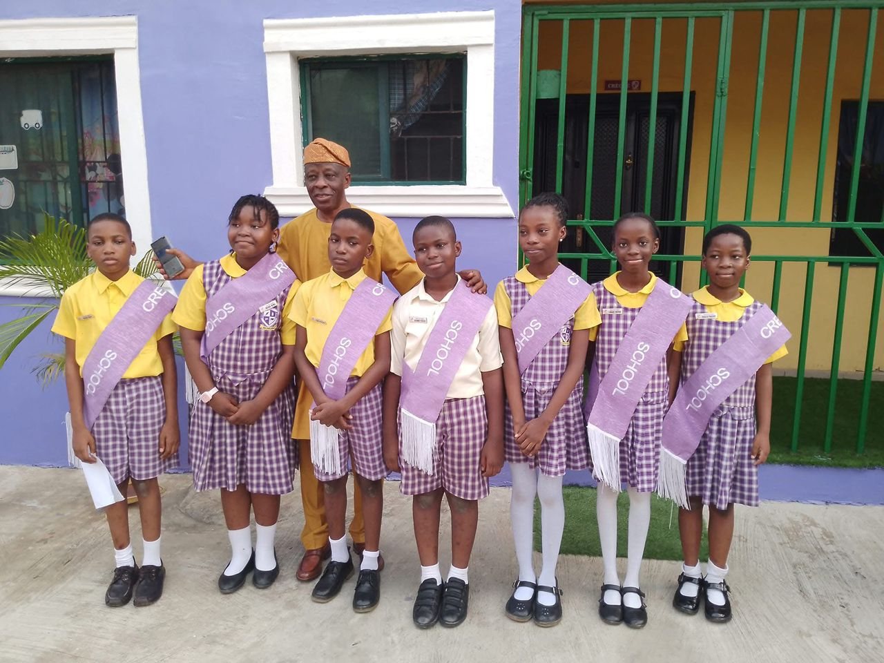 Genius Crest School pupils in golden yellow uniform